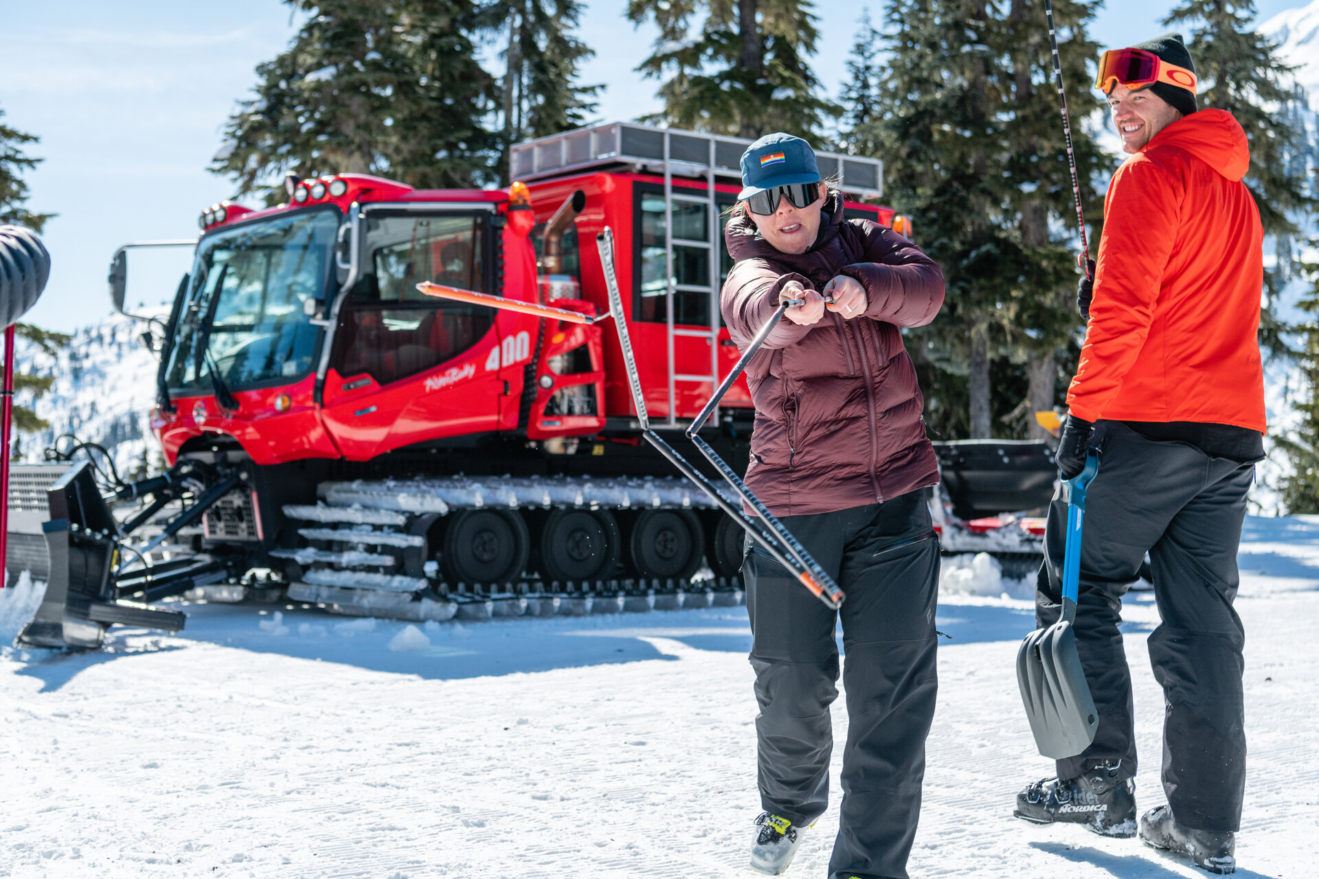 friends getting on a snow mobile